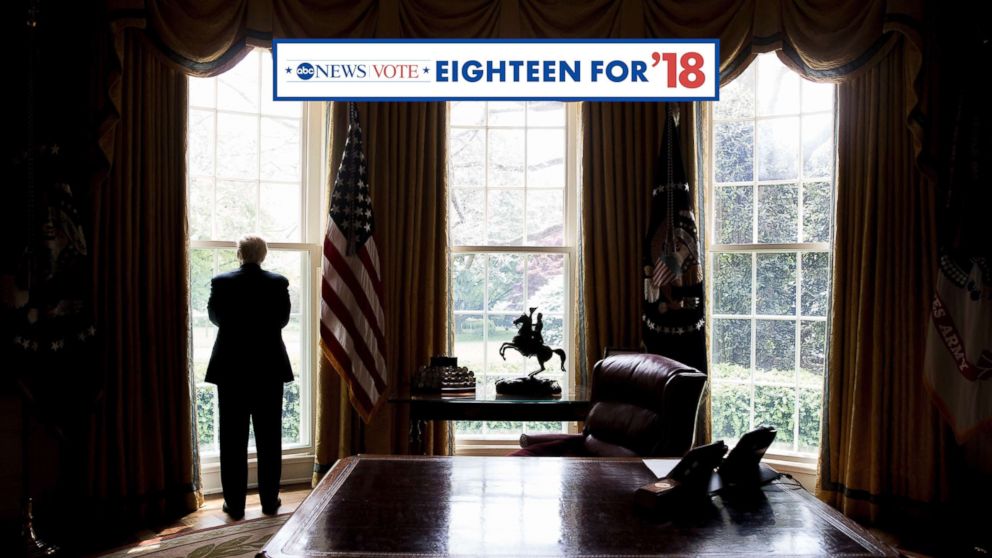 President Donald Trump poses for a photograph in the Oval Office in Washington, April 19, 2017.