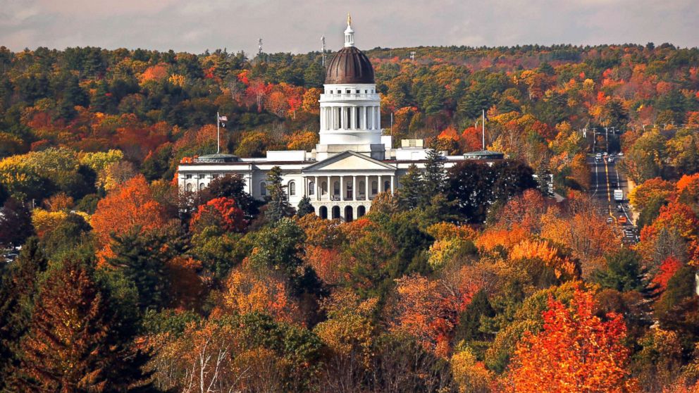 The State House is surrounded by fall foliage, Oct. 23, 2017, in Augusta, Maine.