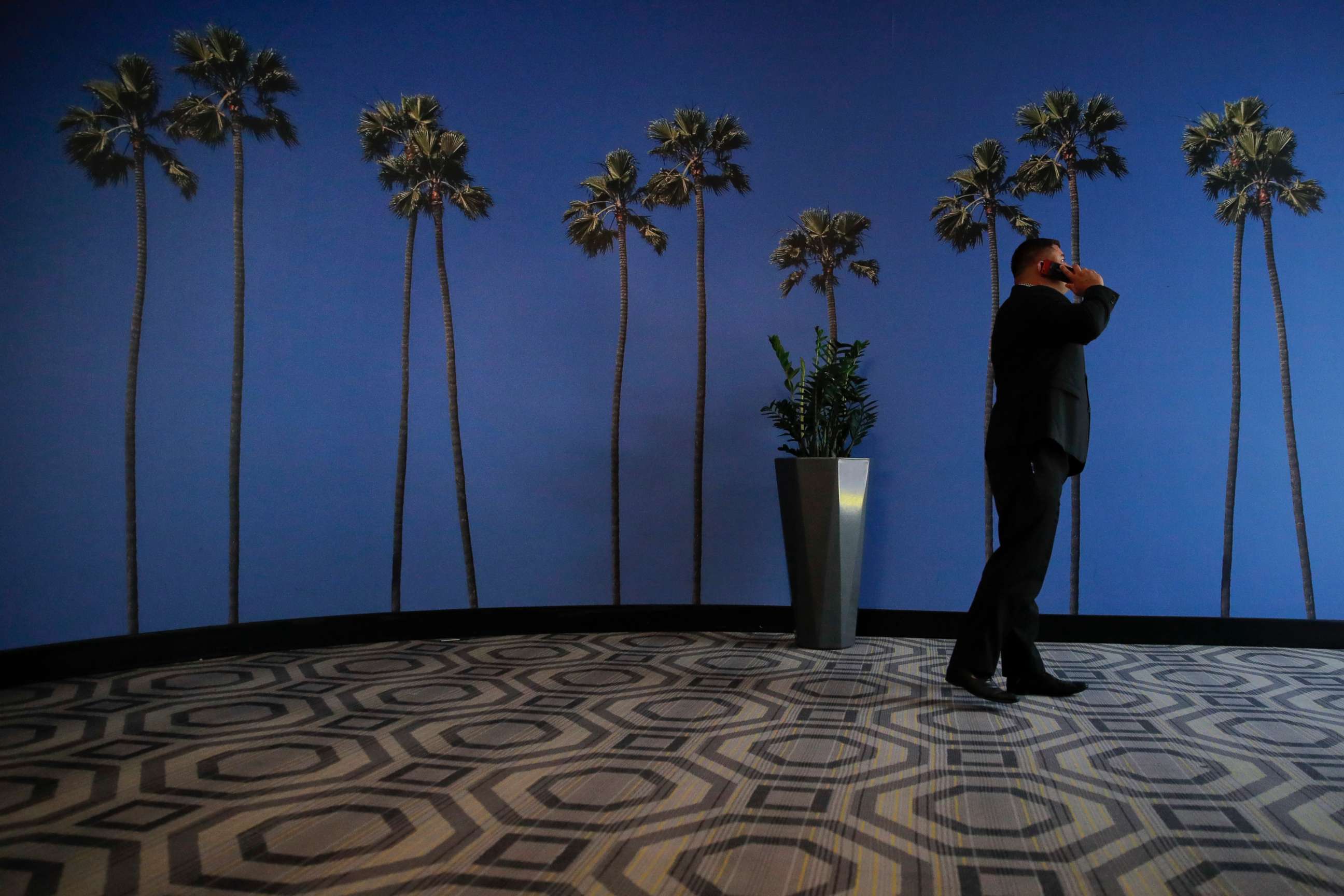 PHOTO: A man talks on the phone at a hotel near the Los Angeles International Airport in Los Angeles, May 4, 2018.