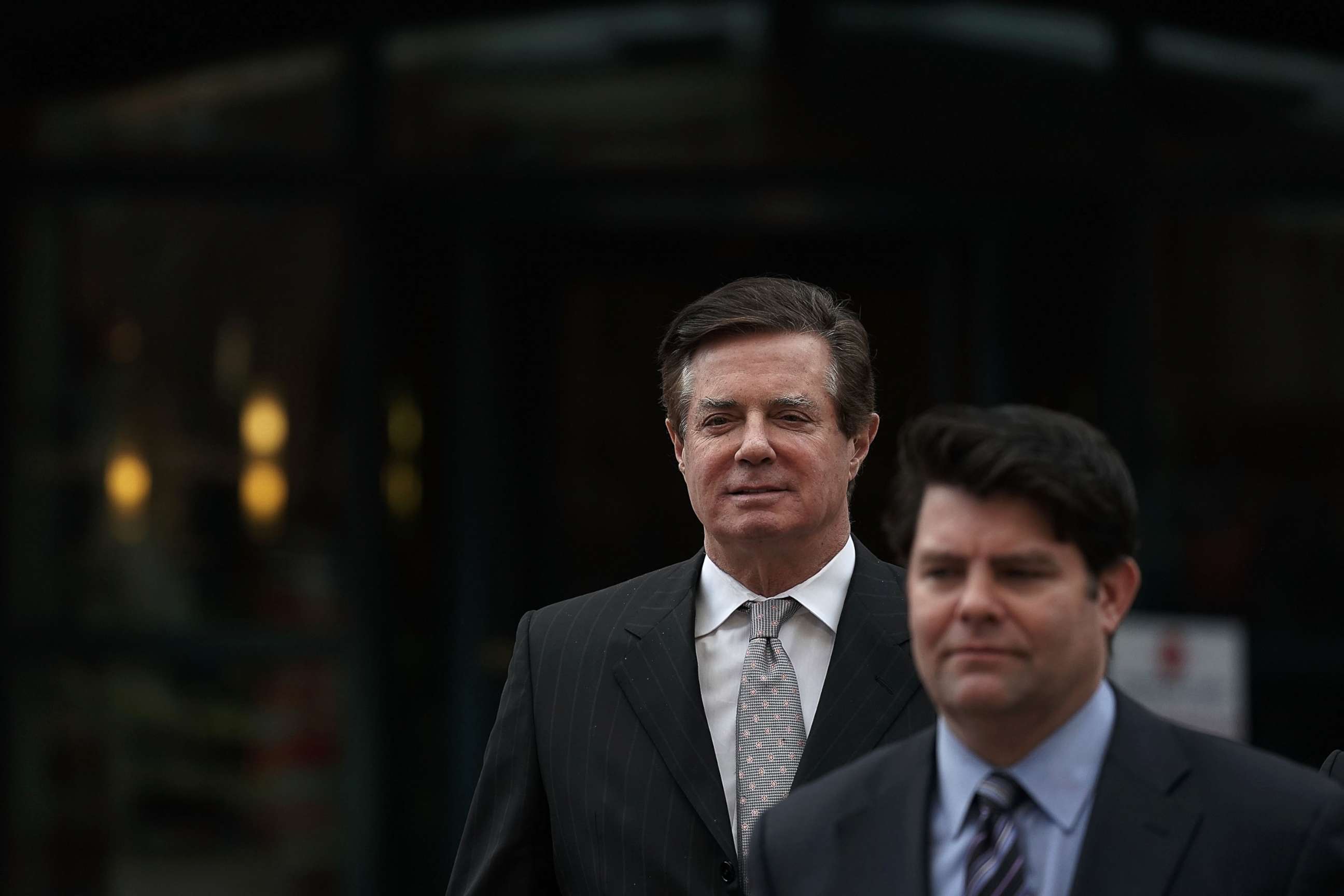 PHOTO: Former Trump campaign manager Paul Manafort (L) leaves the Albert V. Bryan U.S. Courthouse with his spokesman Jason Maloni (R) after an arraignment hearing, March 8, 2018, in Alexandria, Va.