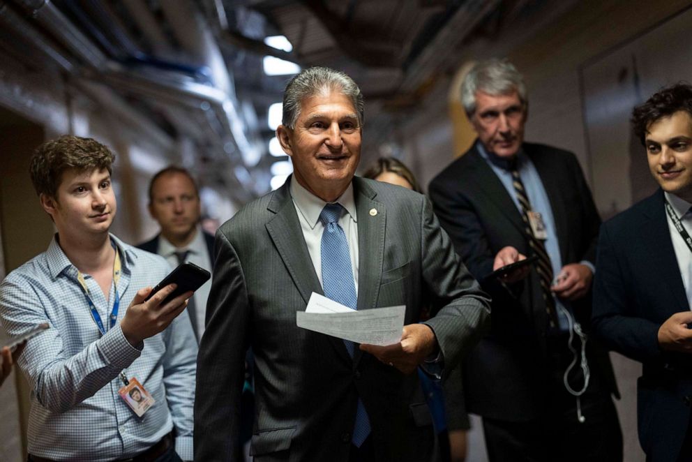 PHOTO: Sen. Joe Manchin walks to a bipartisan meeting on infrastructure after original talks fell through with the White House, June 8, 2021, in Washington, D.C. 