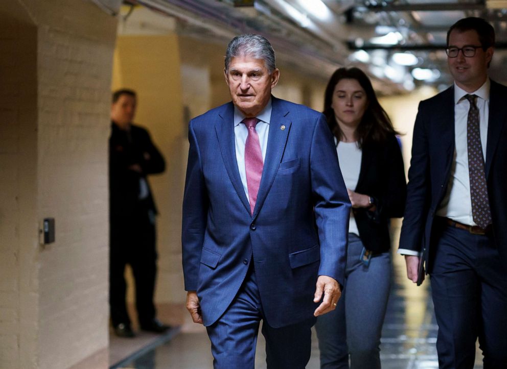 PHOTO: Sen. Joe Manchin walks to meet with Democratic members of the Texas legislature at the Capitol in Washington to discuss voting rights after the group left Austin to try kill a Republican bill that would make voting harder in Texas, July 15, 2021.