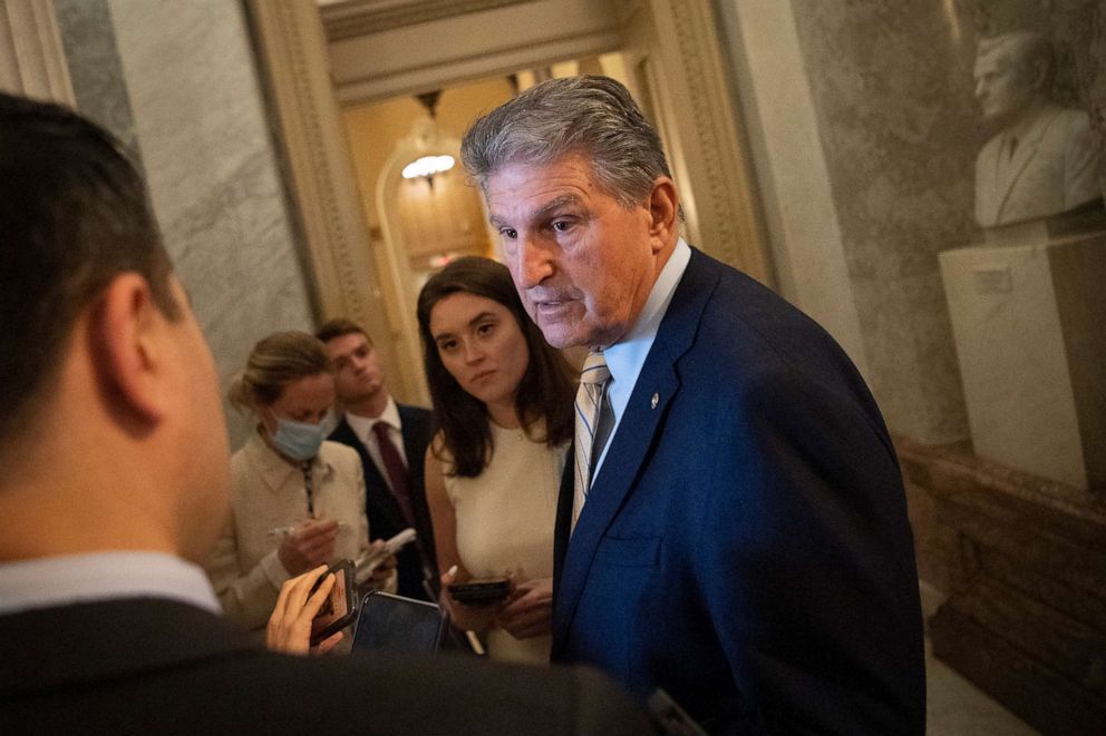 PHOTO:Sen. Joe Manchin, talks with reporters as he departs from the Senate floor after a vote in Washington, D.C., June 22, 2021. 