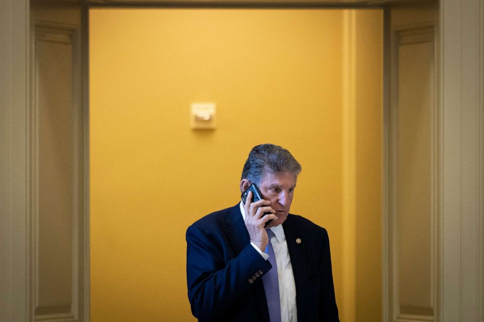 PHOTO: Sen. Joe Manchin talks on the phone outside of a lunch meeting with Senate Democrats, Nov. 16, 2021, in Washington, D.C.