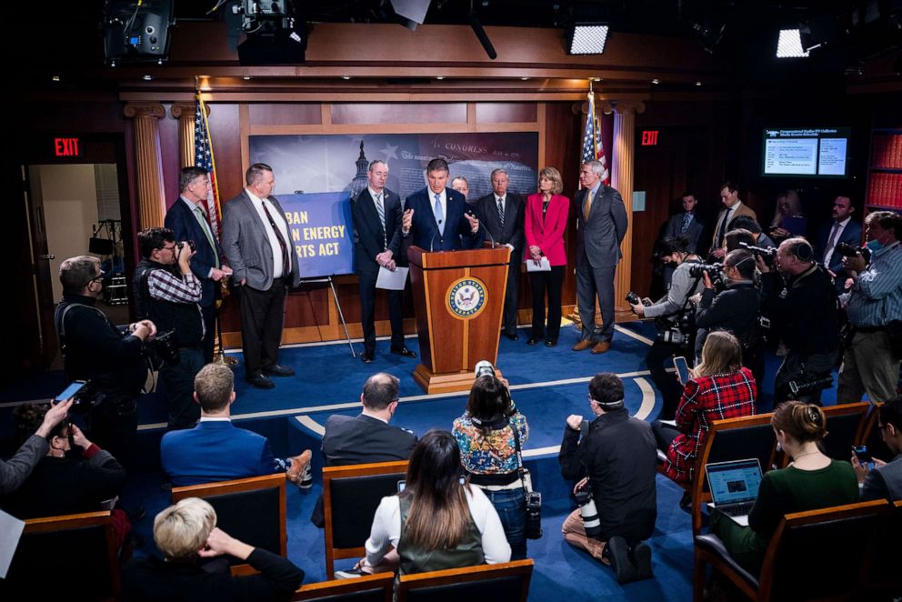 PHOTO: Senator Joe Manchin leads a bipartisan group of Senators announcing they will introduce legislation to ban Russian oil imports at the Capitol, March 3, 2022.