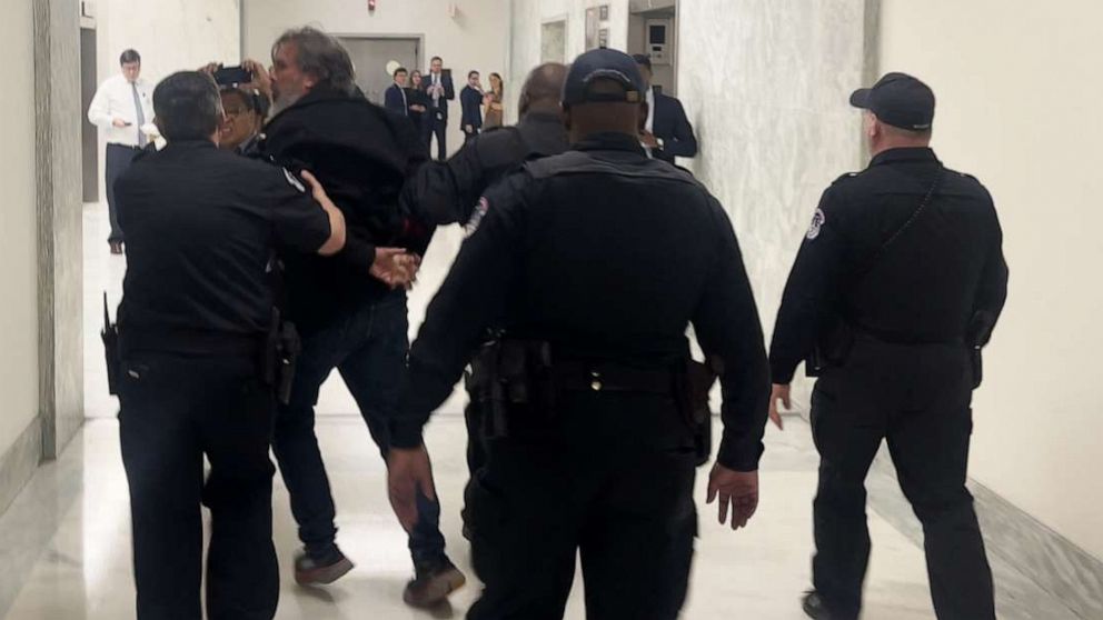 PHOTO: In this screen grab from a video, Manuel Oliver walked away in handcuffs after being arrested outside an Oversight Committee hearing at the U.S. Capitol in Washington, D.C., on March 23, 2023.