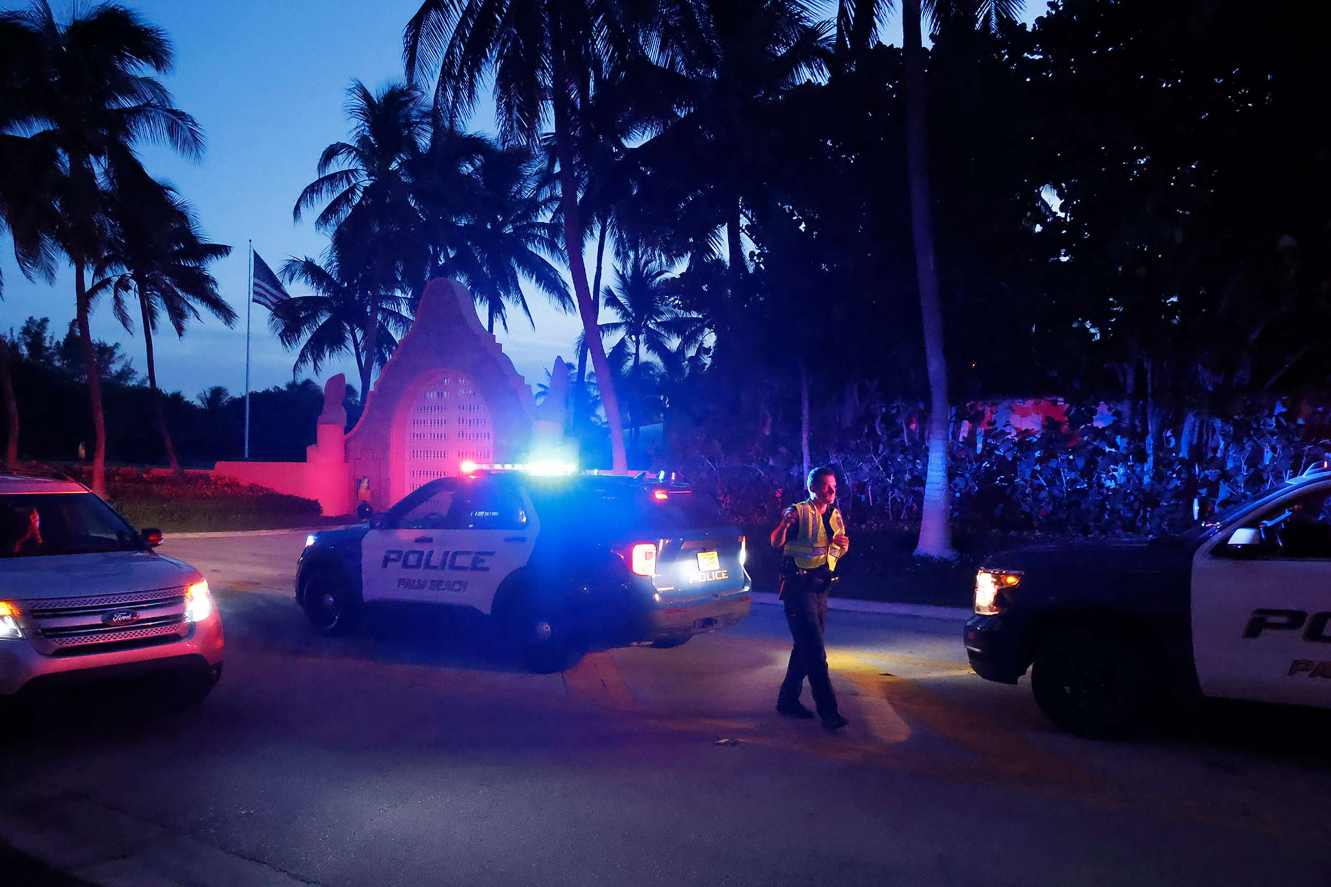 PHOTO: Police direct traffic outside an entrance to former President Donald Trump's Mar-a-Lago estate, Aug. 8, 2022, in Palm Beach, Fla