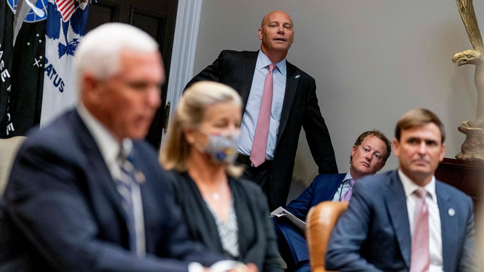 PHOTO: Vice President Mike Pence's Chief of Staff Marc Short, center, listens as Vice President Mike Pence, left, answers a reporter's question, Thursday, Sept. 17, 2020.