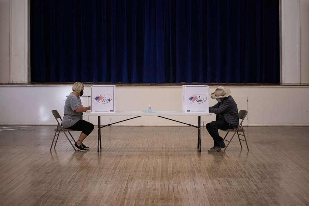 PHOTO: In this Nov. 3, 2020, file photo, local residents Cynthia Daugherty and Eugene Binder vote in the 2020 presidential election in Marfa, Texas.