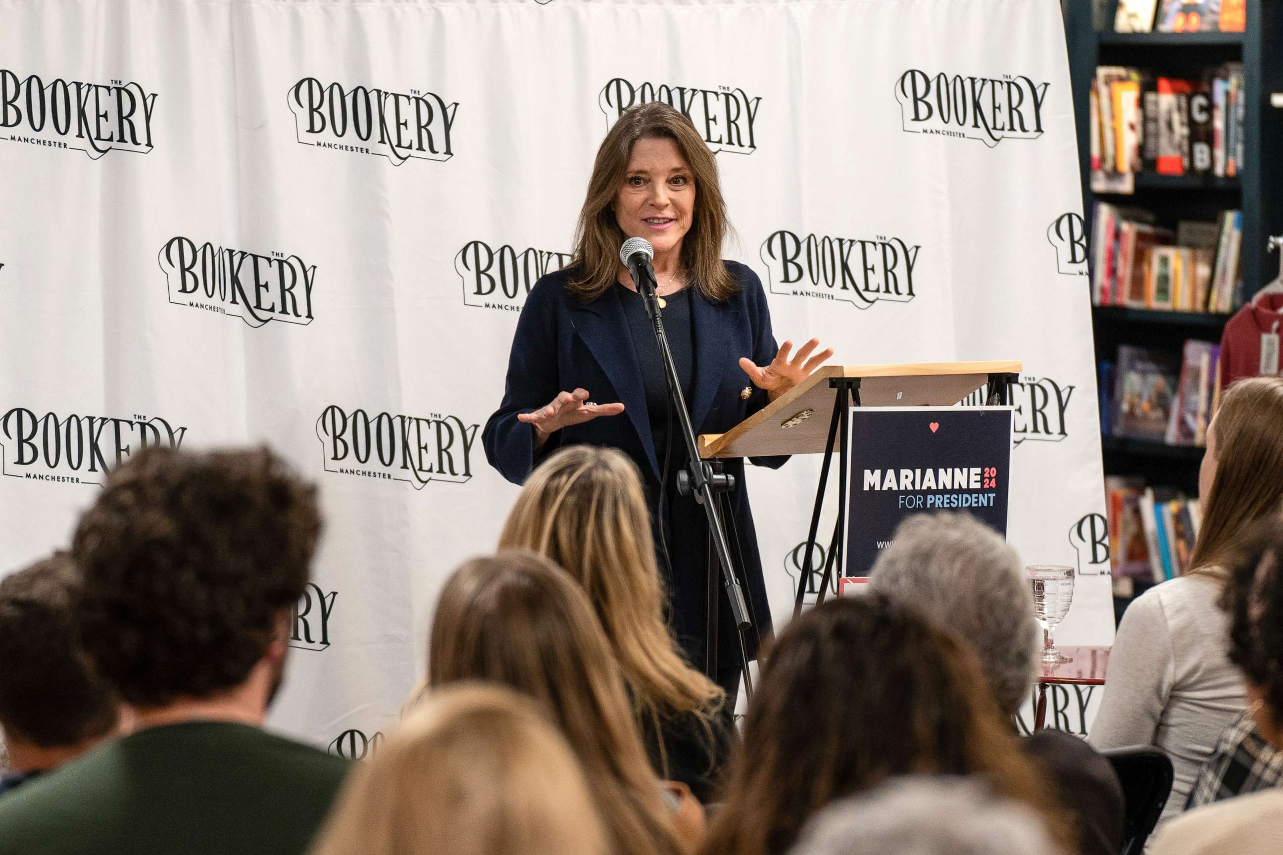 PHOTO: Marianne Williamson discusses her campaign platform with members of the public at Bookery Manchester in Manchester, New Hampshire, March 11, 2023.
