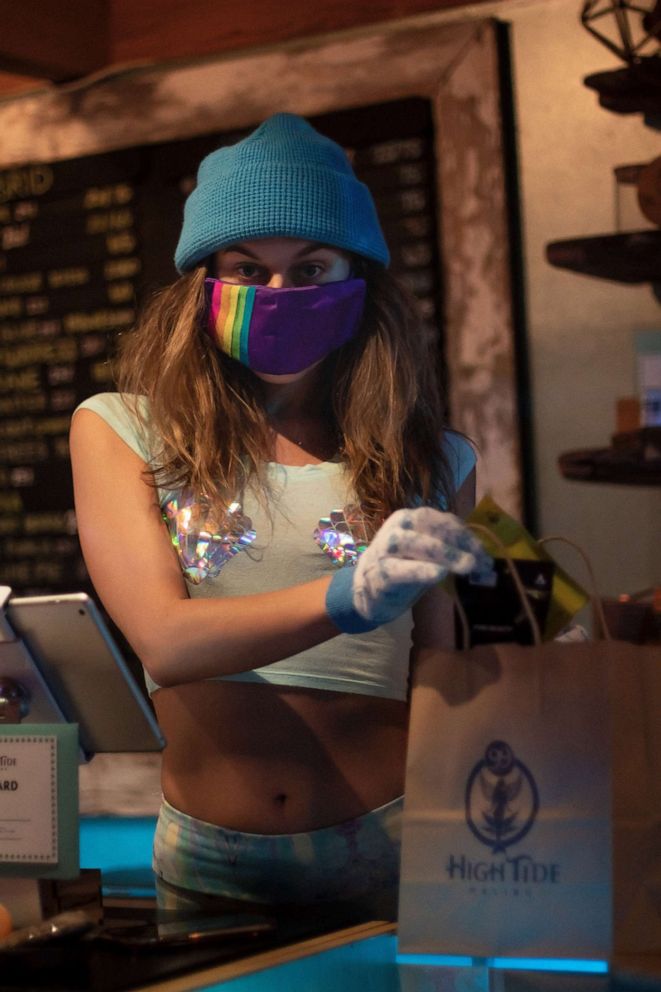 PHOTO: A person is shown in the 99 High Tide marijuana dispensary.