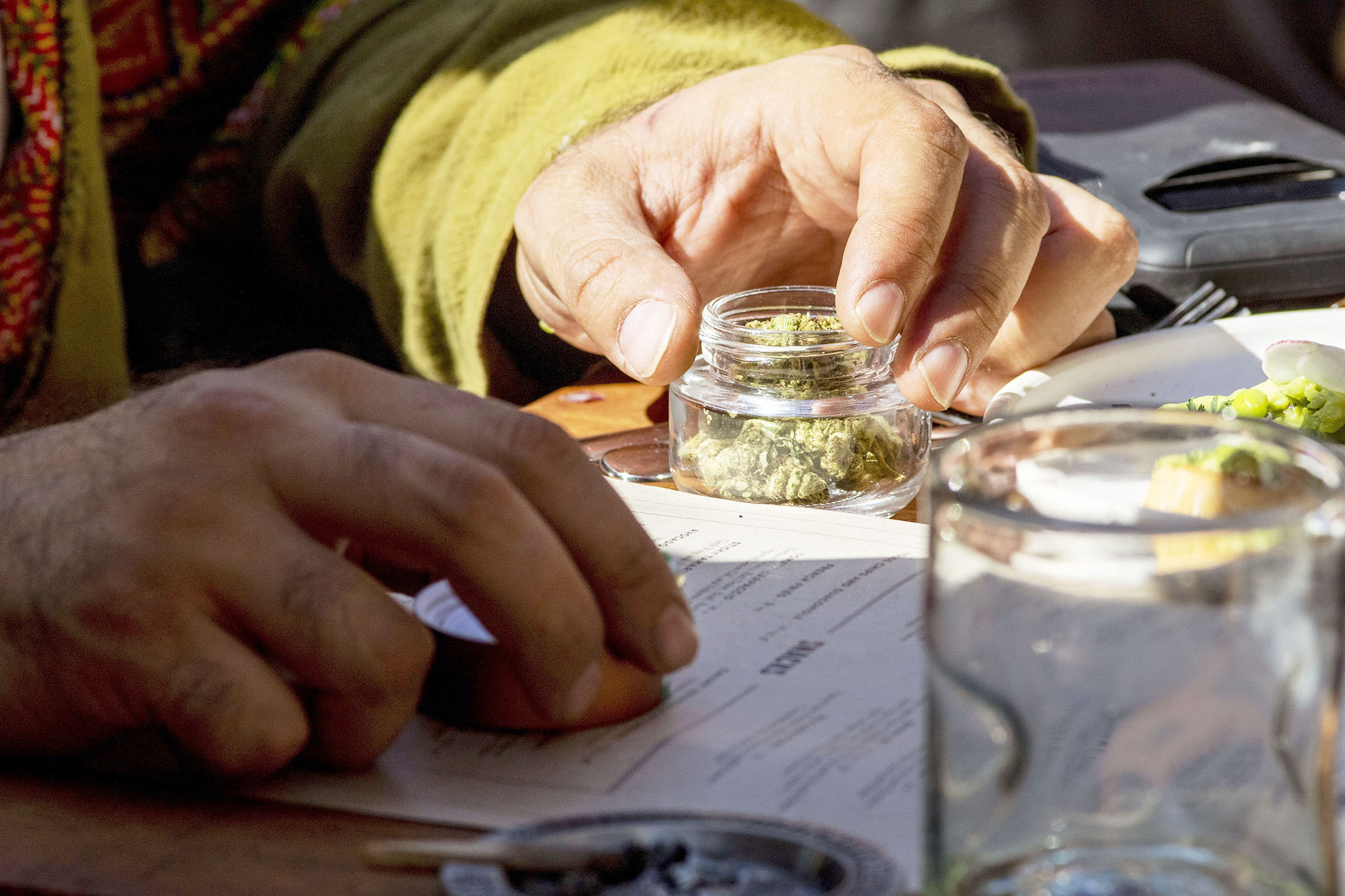 PHOTO: A customer holds a jar of marijuana at a cannabis lounge in West Hollywood, Calif., Oct. 1, 2019.