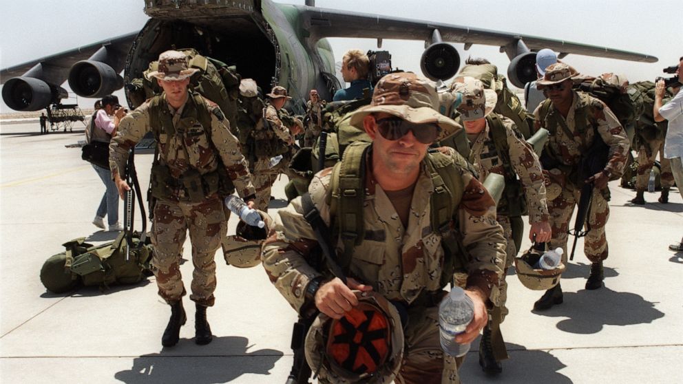 PHOTO: Over 1,000 US Marines from Fort Bragg disembark from a Lockheed C-5 Galaxy transport plane at Dhahran air base in Saudi Arabia, August 21, 1990.