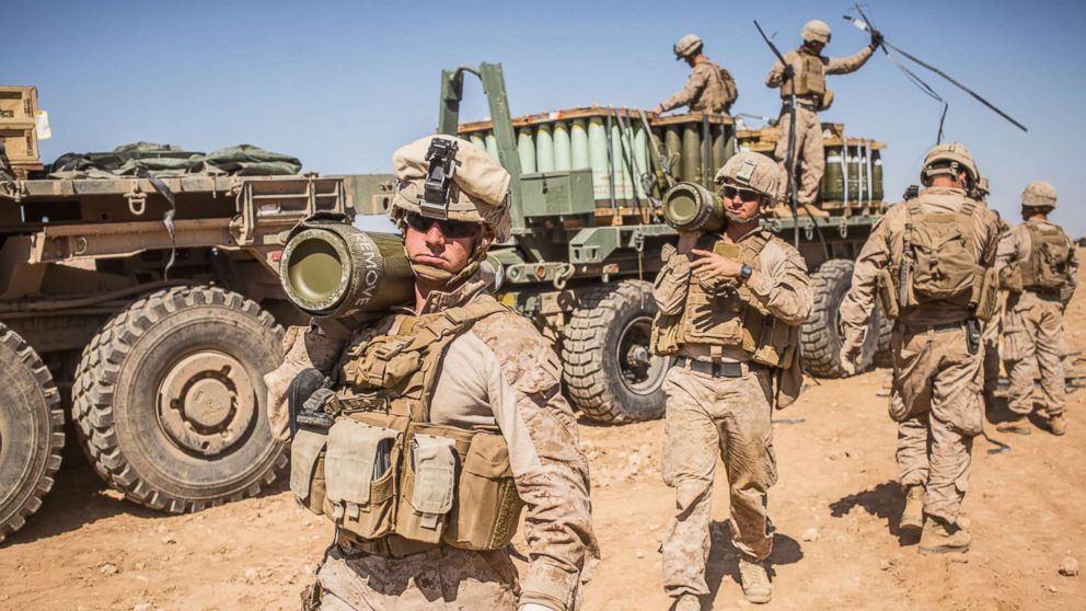 PHOTO: U.S. Marines with the 11th Marine Expeditionary Unit carry rounds to an M777 Howitzer gun line in preparation for fire missions in northern Syria as part of Combined Joint Task Force - Operation Inherent Resolve, Mar. 21, 2017.