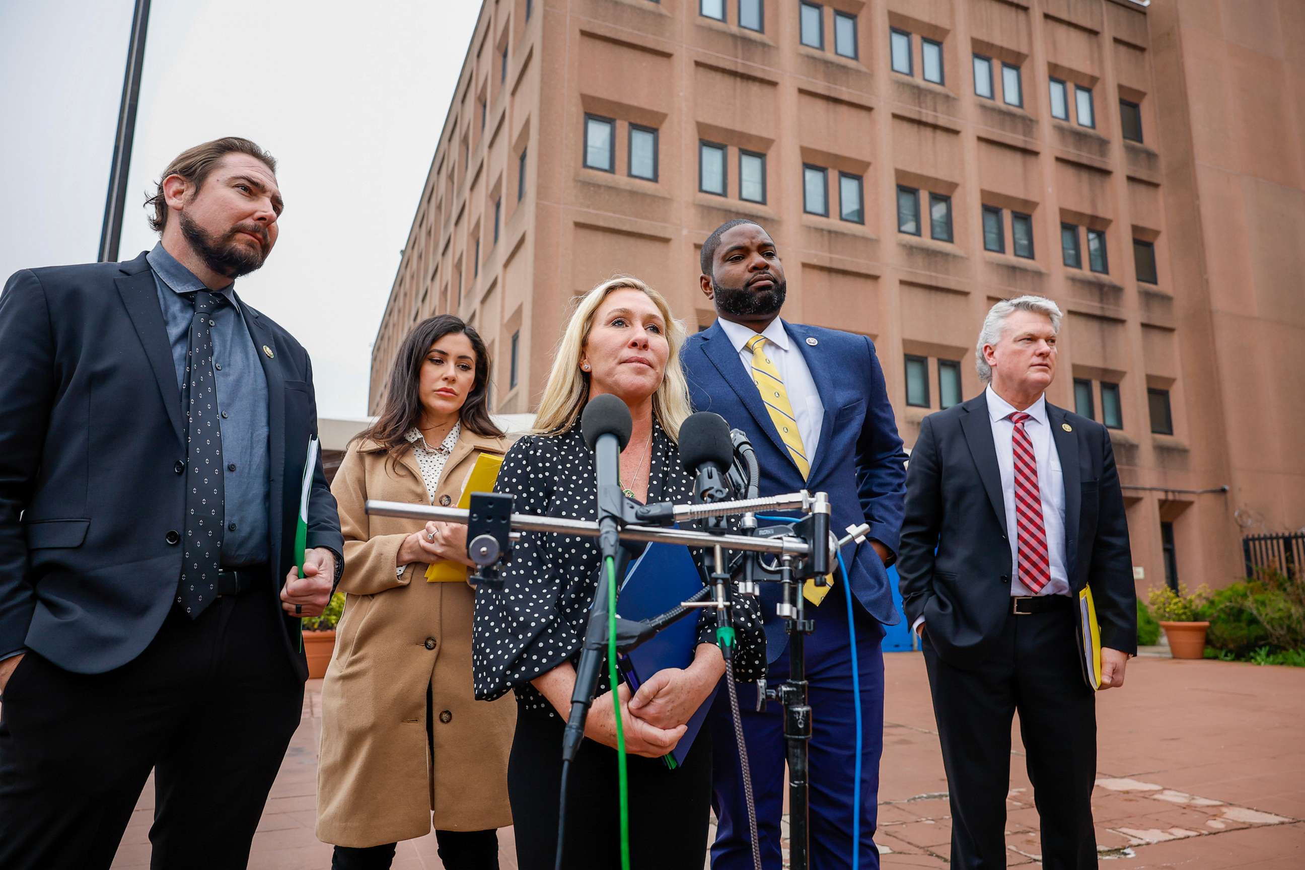 PHOTO: Rep. Marjorie Taylor Greene talks to the media along with Rep. Anna Paulina Luna, Rep. Byron Donalds, and Rep. Mike Collins at the DC Department of Corrections on March 24, 2023, in Washington, D.C.
