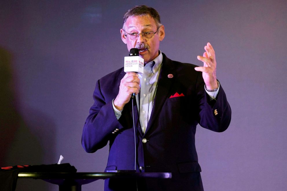 PHOTO: State Rep. Mark Finchem, of Arizona, gestures as he speaks during an election rally in Richmond, Va., on Oct. 13, 2021.