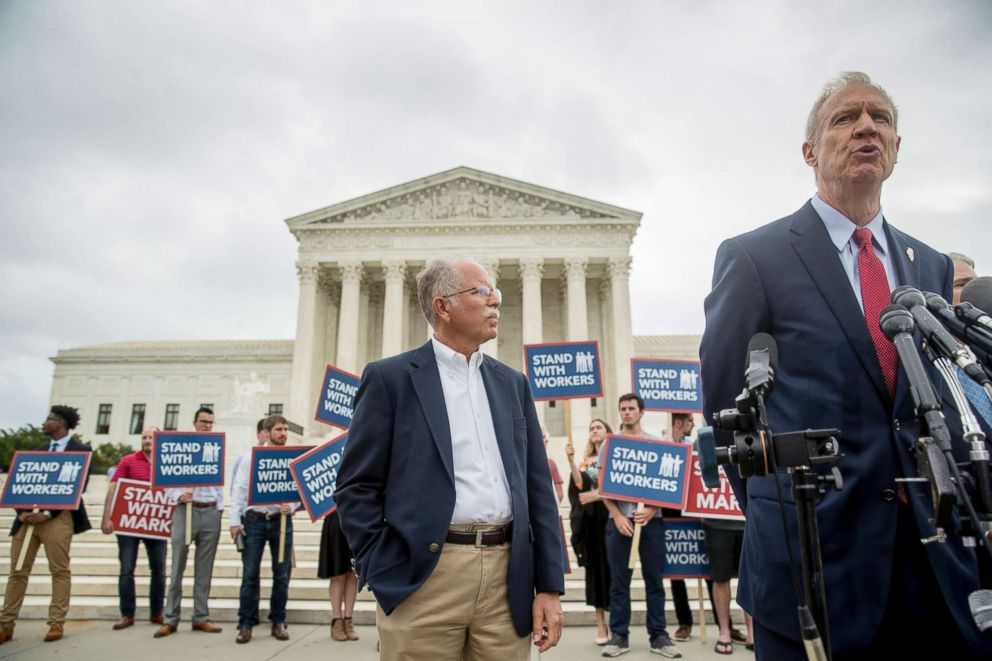 PHOTO: Illinois Gov. Bruce Rauner, right, accompanied by plaintiff Mark Janus, speaks outside the Supreme Court after the court rules in a setback for organized labor that states can't force government workers to pay union fees, June 27, 2018,.