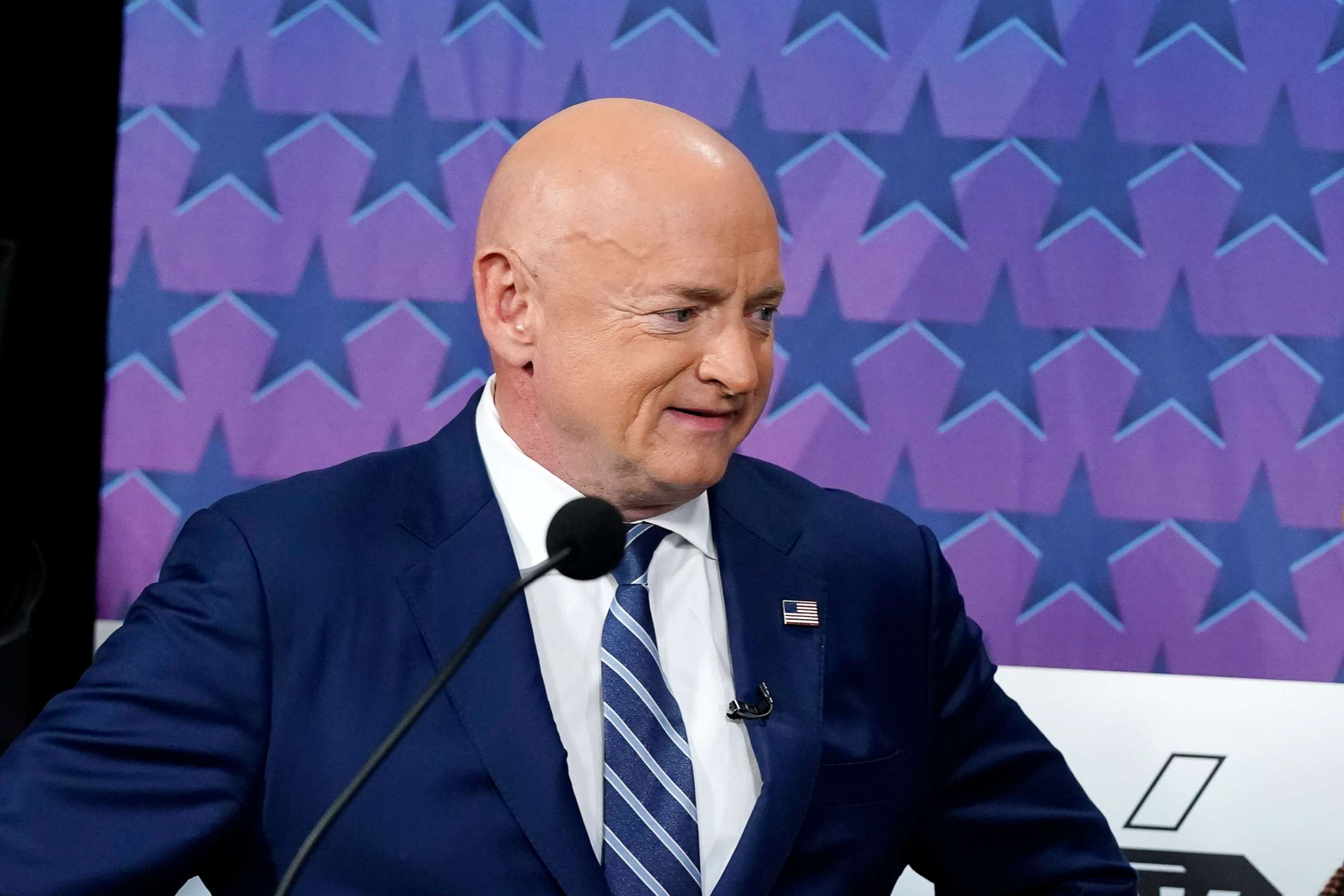 PHOTO: Arizona Democratic Sen. Mark Kelly stands on the stage prior to a televised debate against his Republican challenger Blake Masters and Libertarian candidate Marc Victor in Phoenix, Oct. 6, 2022.