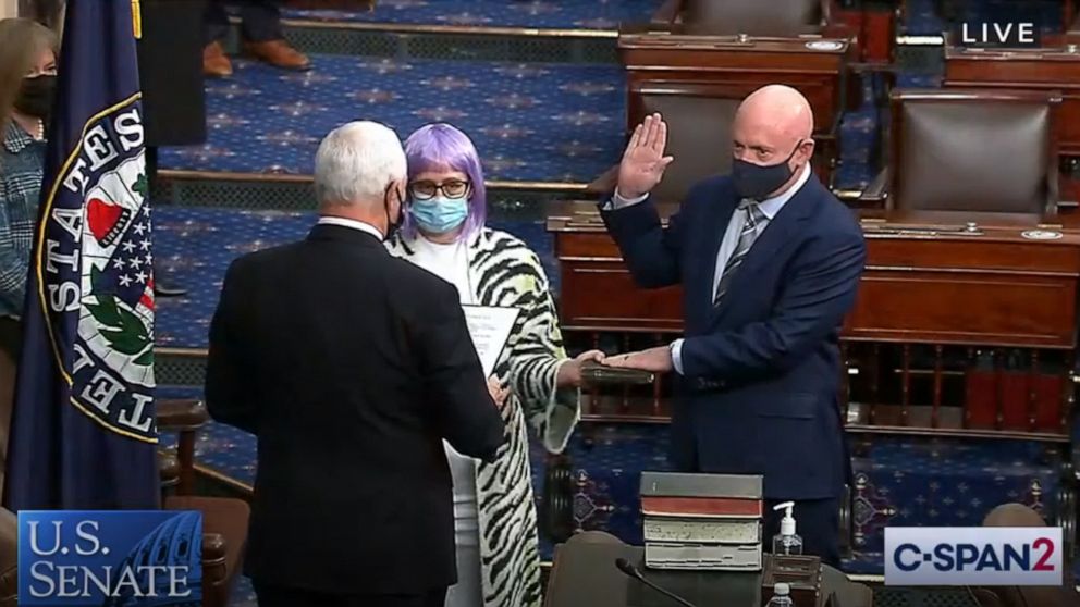 PHOTO: Mark Kelly is sworn in as Arizona's newest senator by Vice-President Mike Pence while standing next former Arizona congresswoman Gabrielle Giffords on the Senate floor in Washington, Dec. 2, 2020.