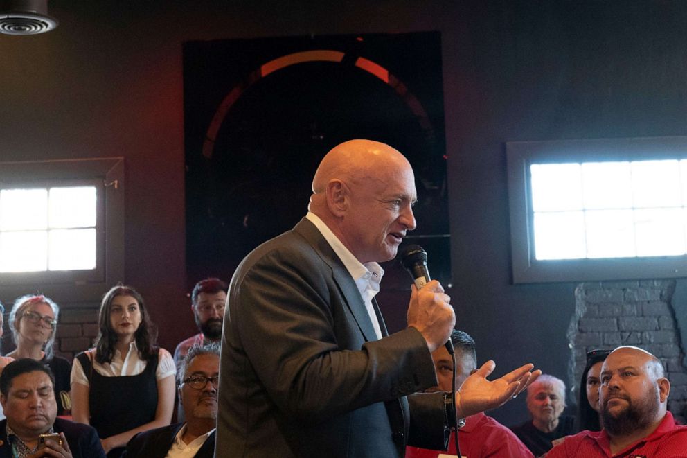PHOTO: Mark Kelly speaks to the crowd during his campaign event at Tres Leches Cafe in Phoenix, May 30, 2019.