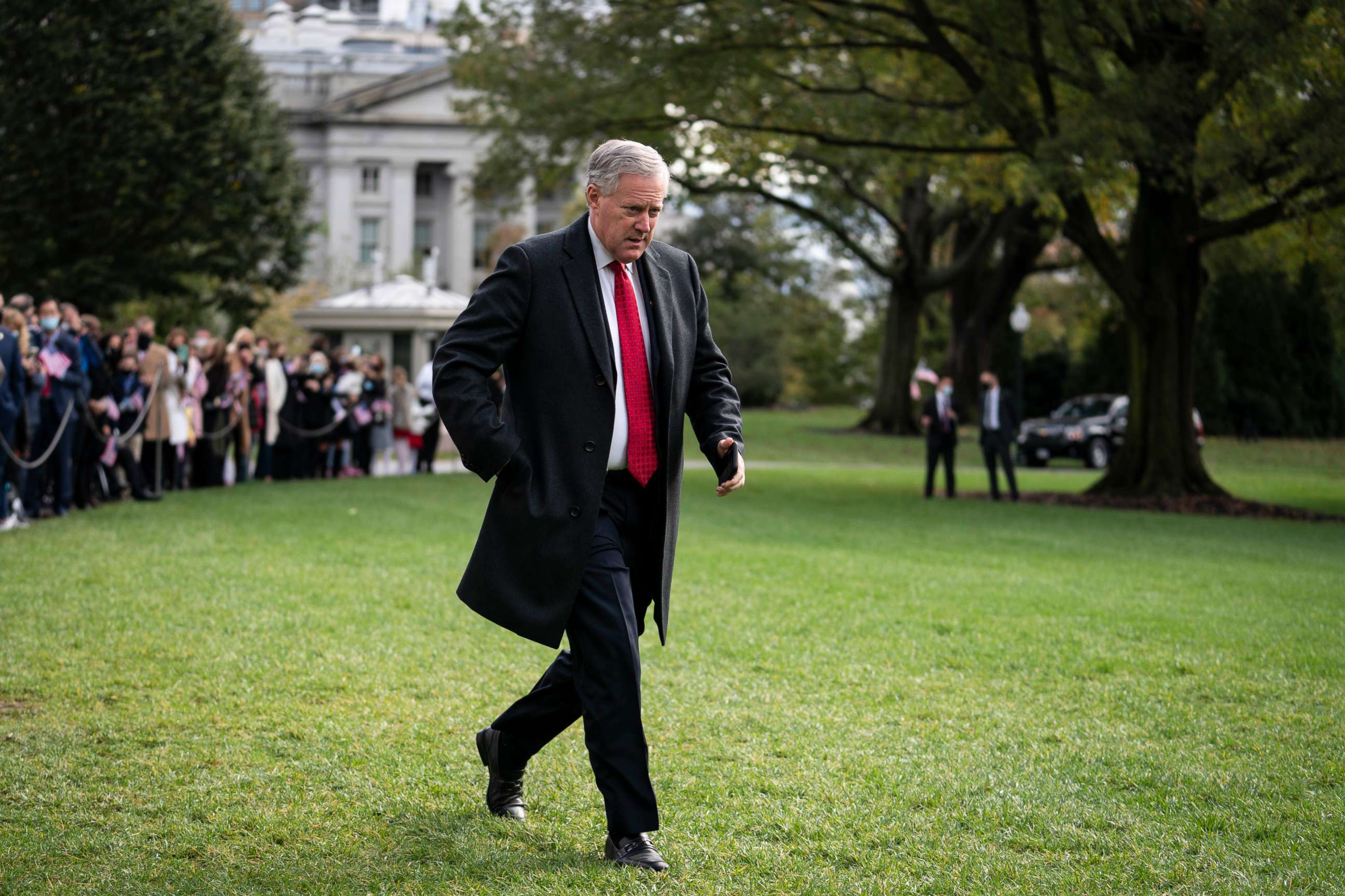PHOTO: White House Chief of Staff Mark Meadows walks along the South Lawn before President Donald Trump departs from the White House on Oct. 30, 2020, in Washington.