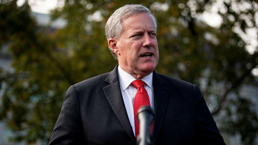 FILE PHOTO: White House Chief of Staff Mark Meadows speaks to reporters following a television interview, outside the White House in Washington, U.S. October 21, 2020.
