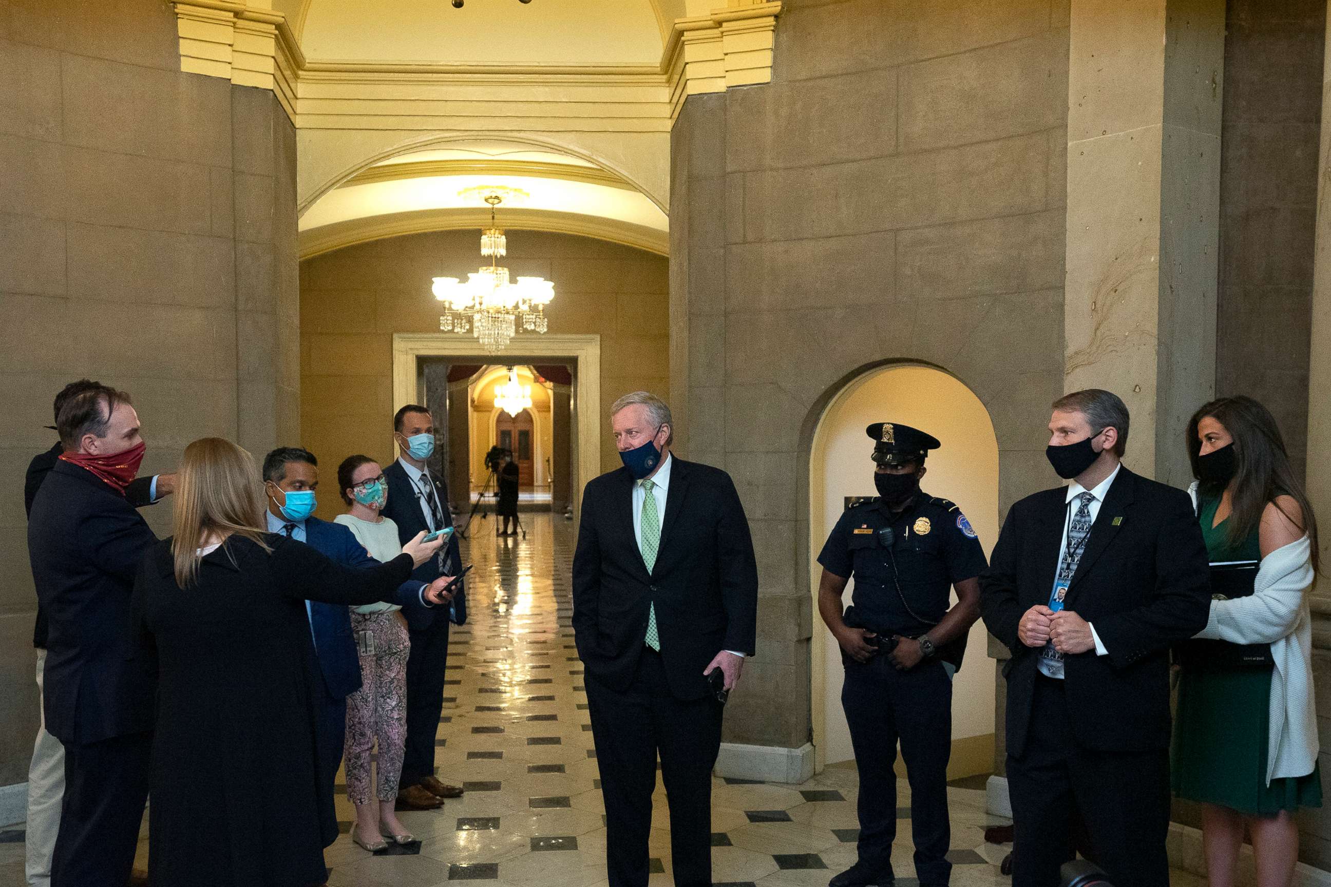 PHOTO: White House Chief of Staff Mark Meadows (C) speaks to members of the media as he arrives for a meeting at the office of Speaker of the House Nancy Pelosi on Aug. 6, 2020, in Washington, DC.
