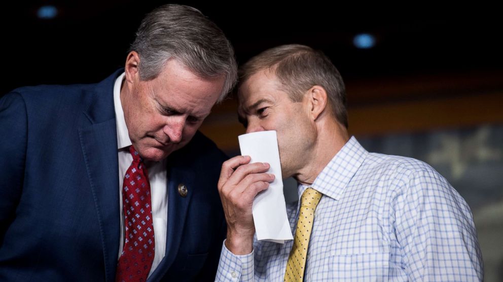 Rep. Mark Meadows, left, and Rep. Jim Jordan talk during the press conference calling on President Trump to declassify the Carter Page FISA applications, Sept. 6, 2018.
