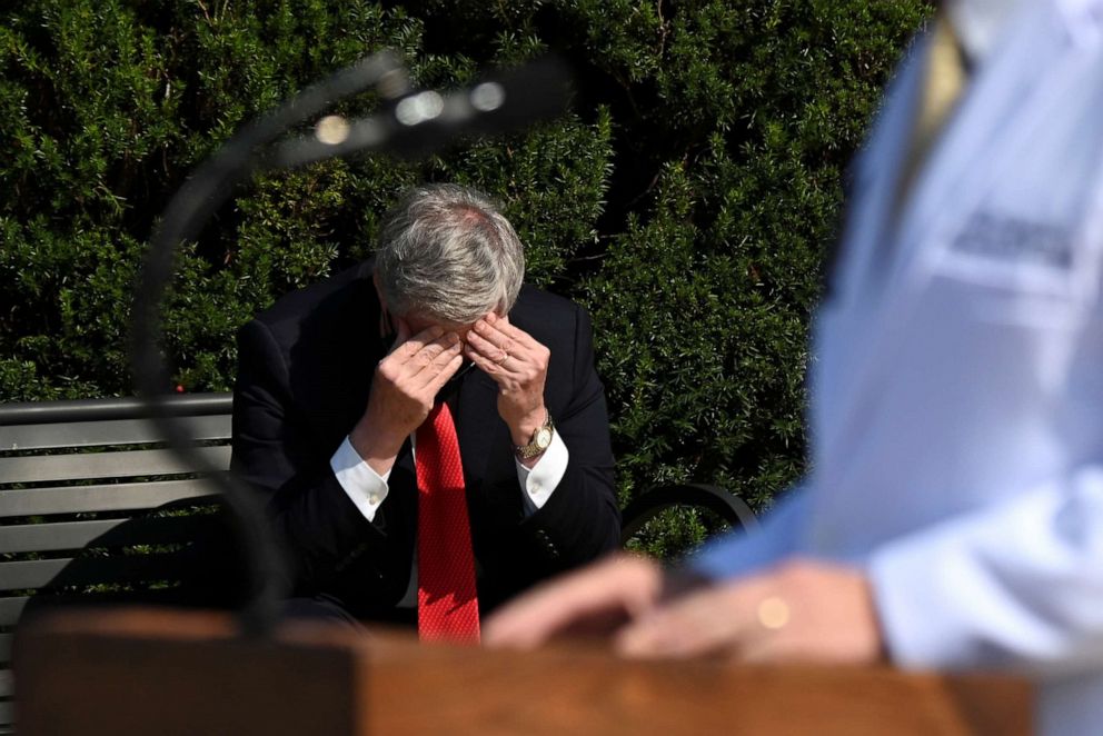 PHOTO: White House Chief of Staff Mark Meadows rubs his head, as Navy Commander Dr. Sean Conley, speaks to the media about President Donald Trump's health at Walter Reed National Military Medical Center in Bethesda, Maryland, Oct. 4, 2020.
