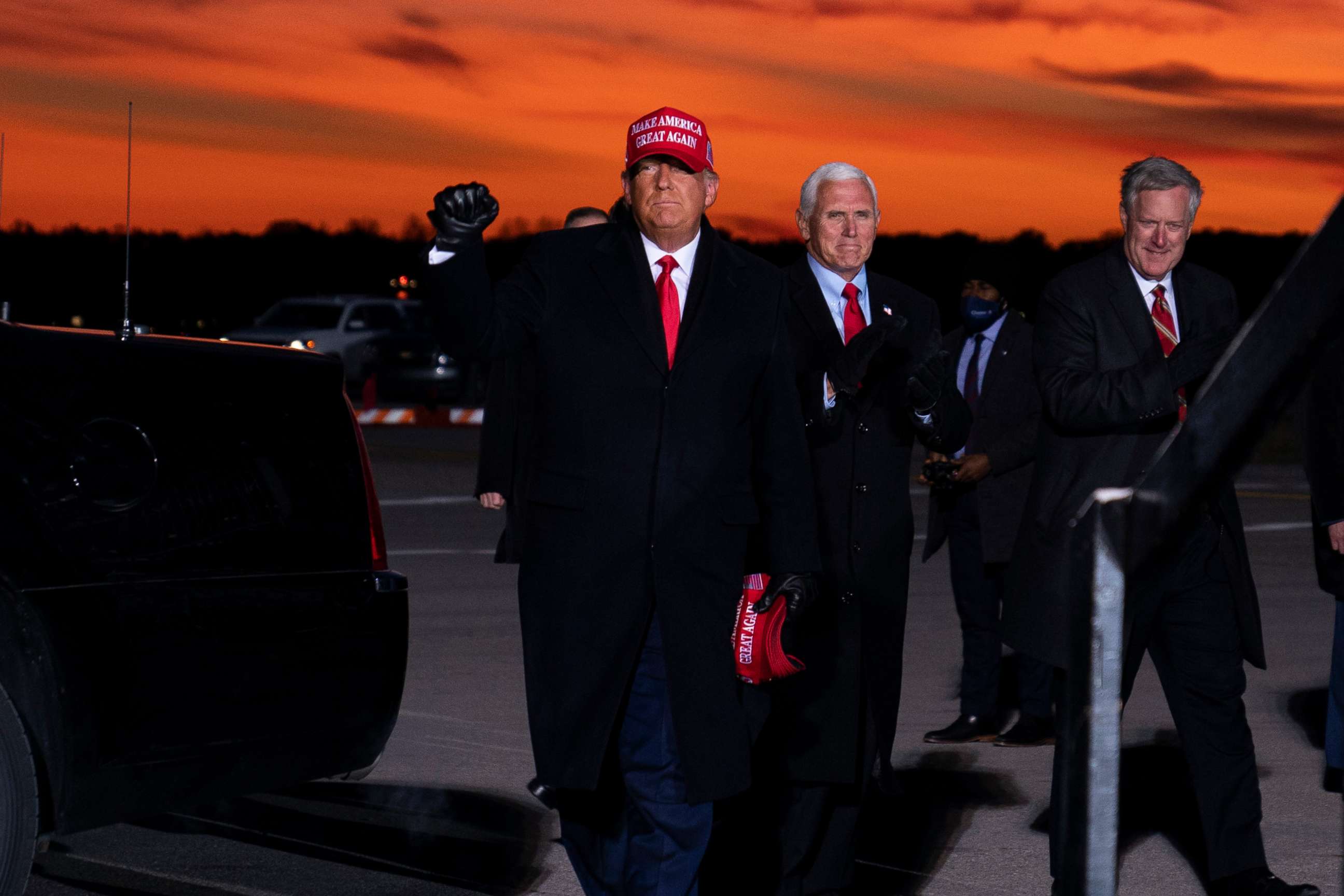 PHOTO: White House chief of staff Mark Meadows accompanies President Donald Trump and Vice President Mike Pence as they arrive for a campaign rally at Cherry Capital Airport, Nov. 2, 2020, in Traverse City, Mich.