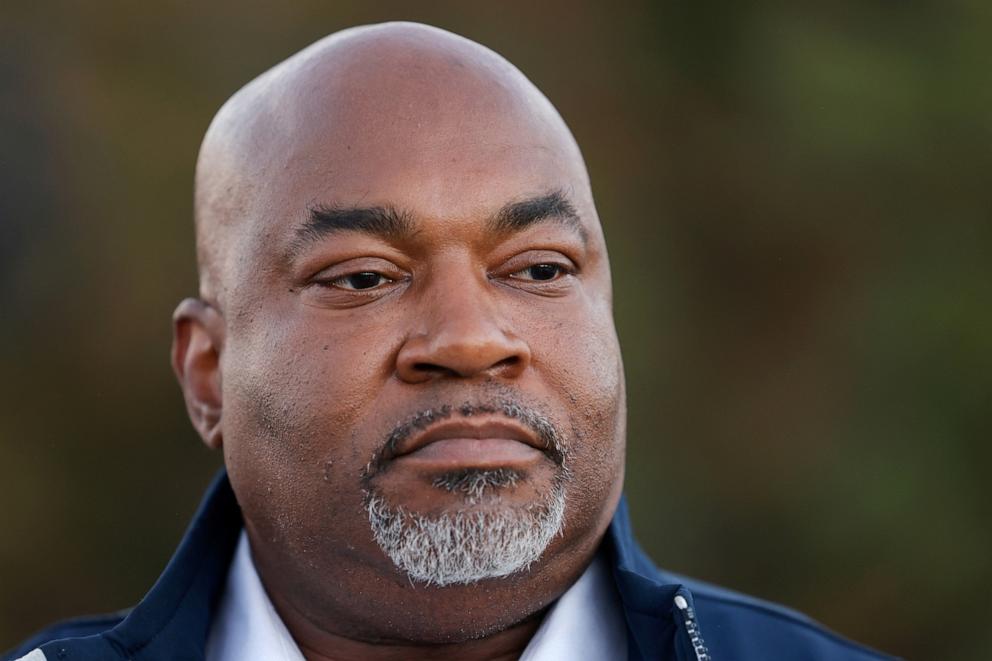 PHOTO: Mark Robinson, the Republican candidate for governor of North Carolina, listens to a question from the media after campaigning at an ice cream shop, in Ellerbe, N.C., Oct. 30, 2024.