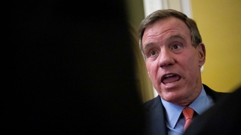 PHOTO: Senator Mark Warner speaks to reporters at the Capitol in Washington, DC, on January 24, 2023.