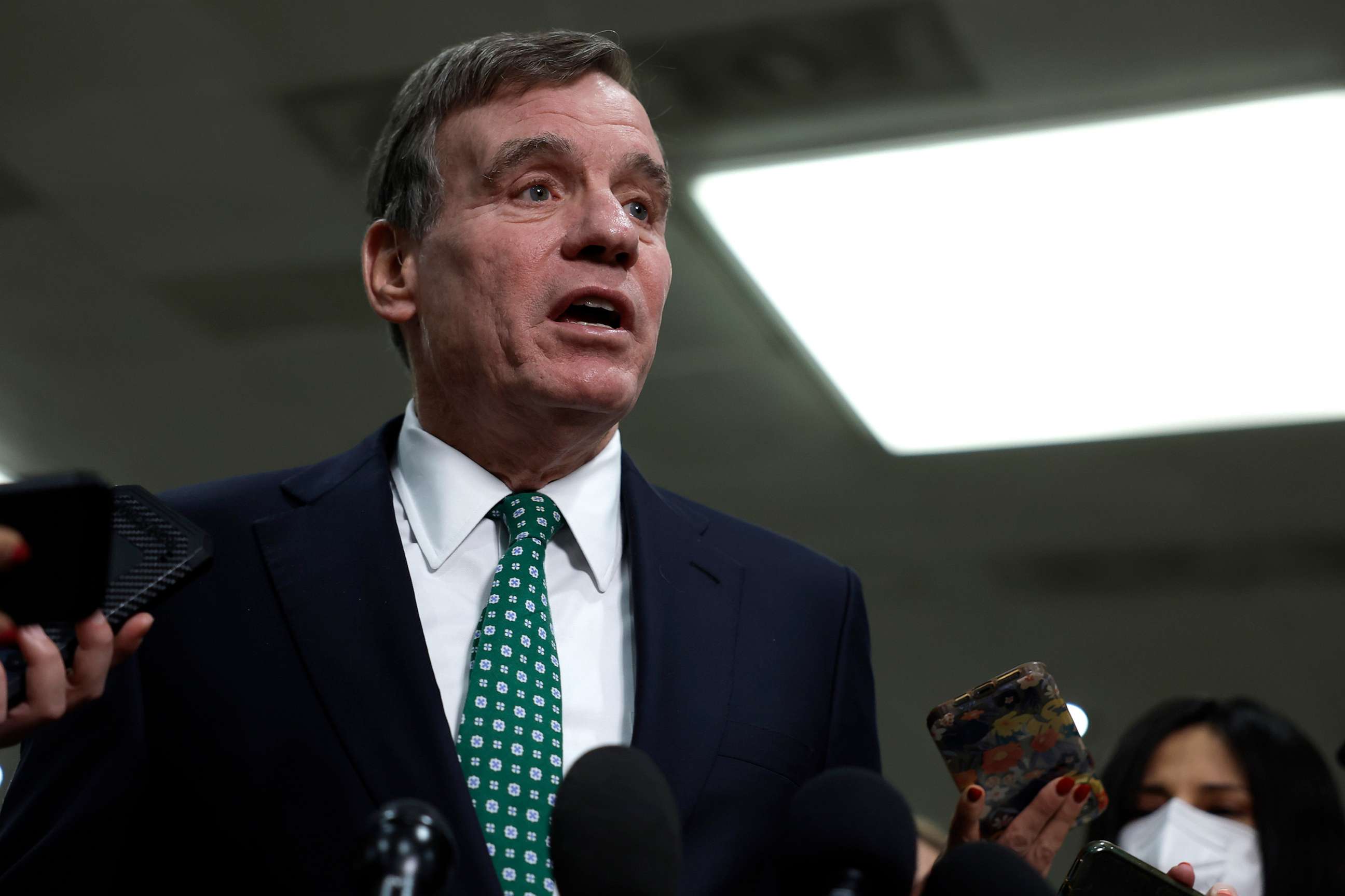 PHOTO: Sen. Mark Warner speaks with reporters after attending a closed-door, classified briefing for Senators at U.S. Capitol Building on Feb. 14, 2023, in Washington, D.C.