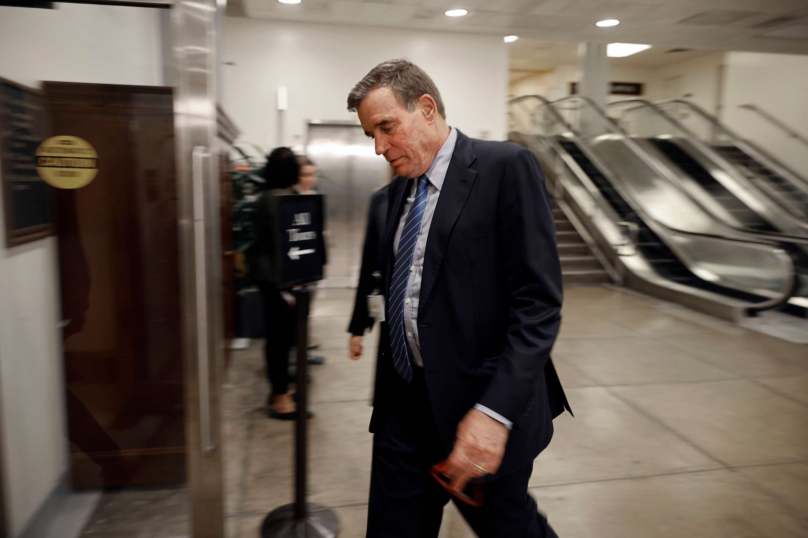 PHOTO: Senate Intelligence Committee Co-Chair Mark Warner heads for a closed-door briefing at the U.S. Capitol Visitors Center on April 19, 2023, in Washington, D.C.