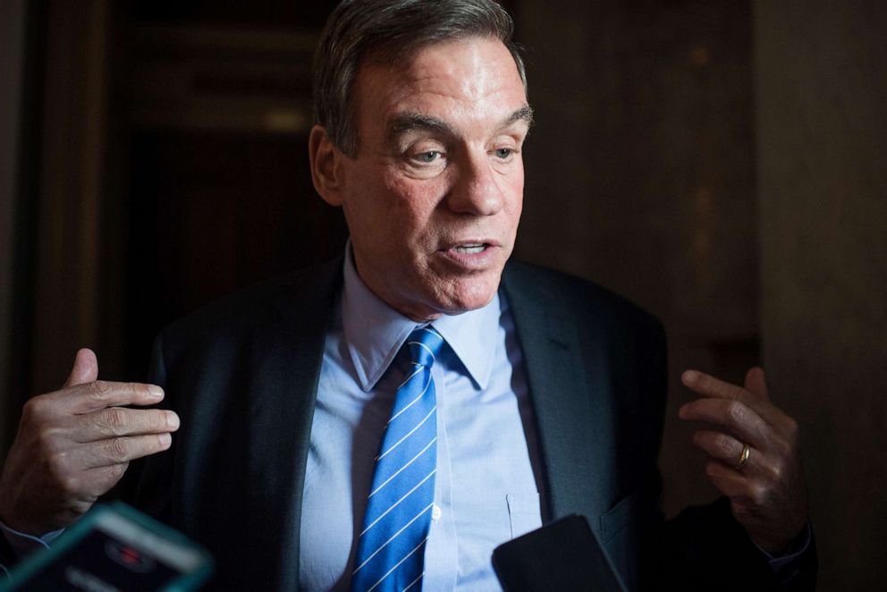 PHOTO: Sen. Mark Warner talks with reporters at the U.S. Capitol, July 9, 2019, in Washington, D.C.