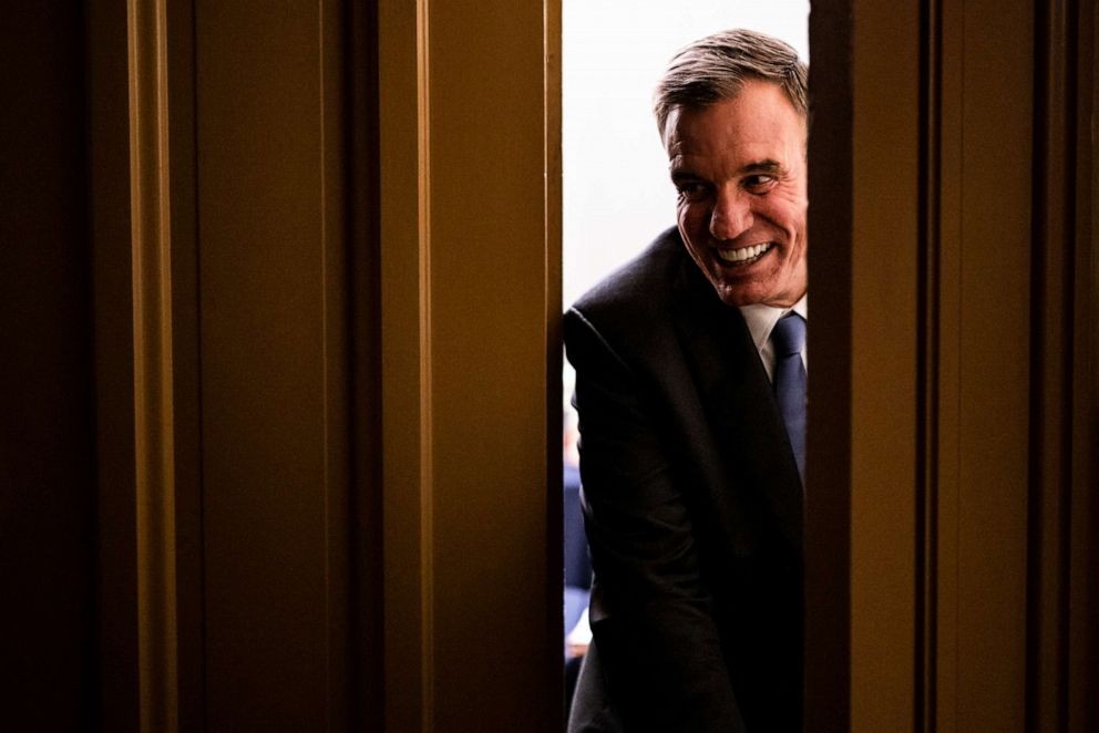 Sen. Mark Warner, D-Va., heads back into the room where a bipartisan group of Senators and White House officials are holding negotiations for a proposed infrastructure plan at the U.S. Capitol on June 23, 2021 in Washington.