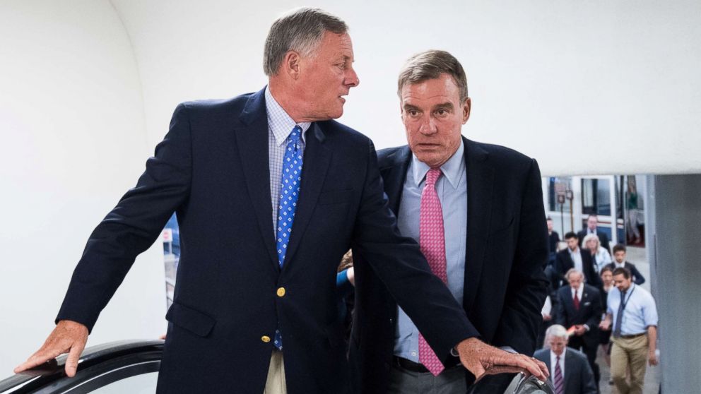 Sen. Richard Burr, left, speaks with Sen. Mark Warner as they arrive in the Capitol for a vote on Aug. 16, 2018 in Washington, D.C.
