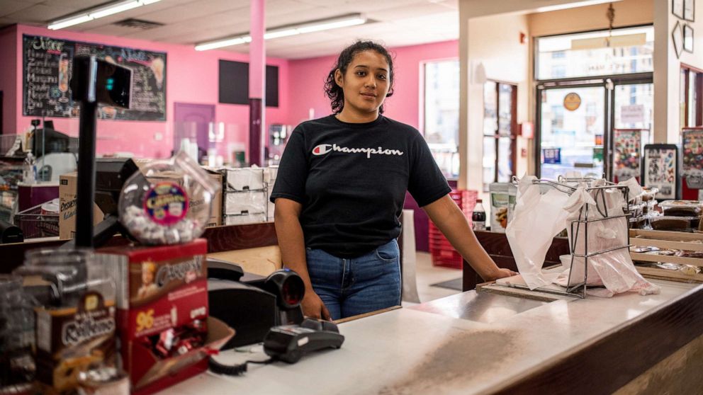 PHOTO: America Zaragroa poses for a portrait inside Zamora Fresh Market in Marshalltown, Iowa, Aug. 7, 2019, which has a growning Hispanic and Latino community.
