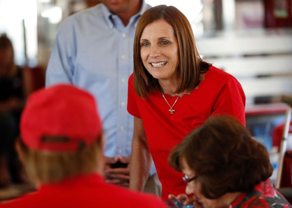 PHOTO: Arizona Republican senatorial candidate Martha McSally, speaks with voters, Nov. 6, 2018, at Chase's diner in Chandler, Ariz.