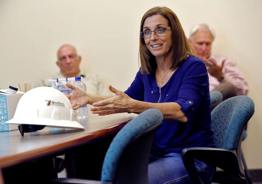 PHOTO: U.S. Rep. Martha McSally, who is running against U.S. Rep. Kyrsten Sinema, for the senate seat being vacated by retiring U.S. Sen. Jeff Flake, talks to employees at a crane manufacturing and training facility, in Phoenix, Oct. 3, 2018.