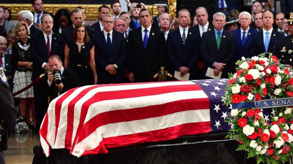 Wrinkled flag online on coffin