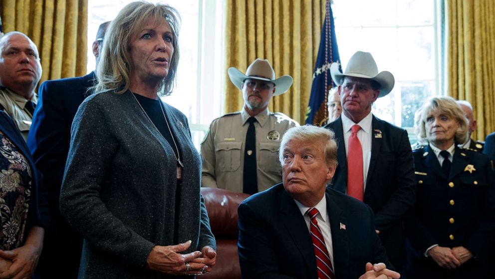 PHOTO: President Donald Trump listens as Mary Ann Mendoza, an "Angel Mom" who lost her son Brandon when he was killed by a drunk driver that was an undocumented immigrant, speaks in the Oval Office of the White House, March 15, 2019, in Washington.