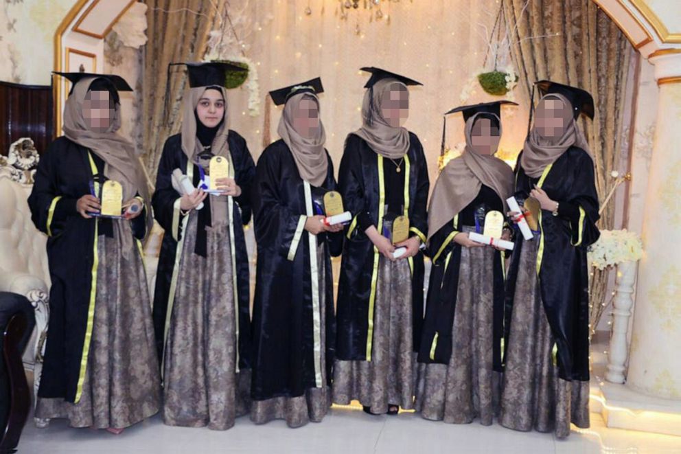 PHOTO: Maryam Jami, 23, a semi-finalist for the Fulbright Foreign Student Program, poses with classmates at her law graduation from Herat University in Dec. 2019.