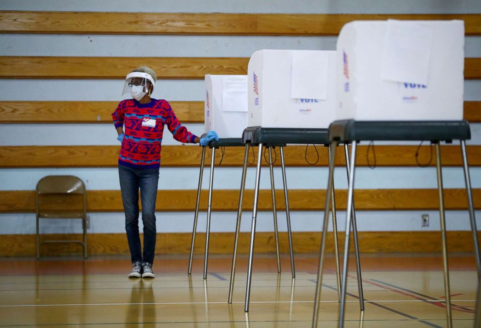 PHOTO: An election official waits for people to vote at a polling station located in the Morgan State University in Baltimore during early voting in Maryland, Oct. 26, 2020.