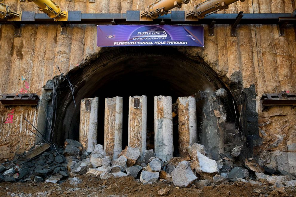PHOTO: FILE - Workers break through the end of a 1,000-foot tunnel being built to carry Purple Line trains beneath a Silver Spring neighborhood. This is the break-through on the lower shelf, so the entire tunnel is now dug out, Feb. 28, 2019.