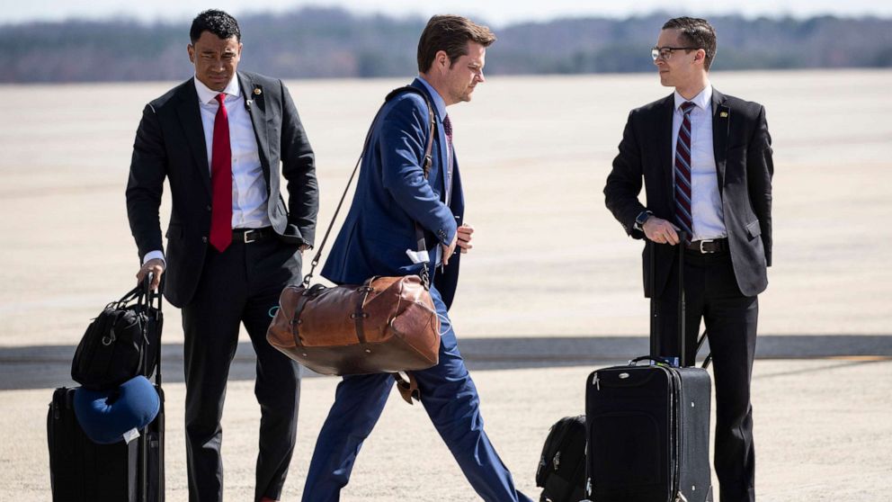 PHOTO: Rep. Matt Gaetz, center, walks on the tarmac after stepping off Air Force One after arriving at Andrews Air Force Base, Md., March 9, 2020 from Mar-a-Lago.