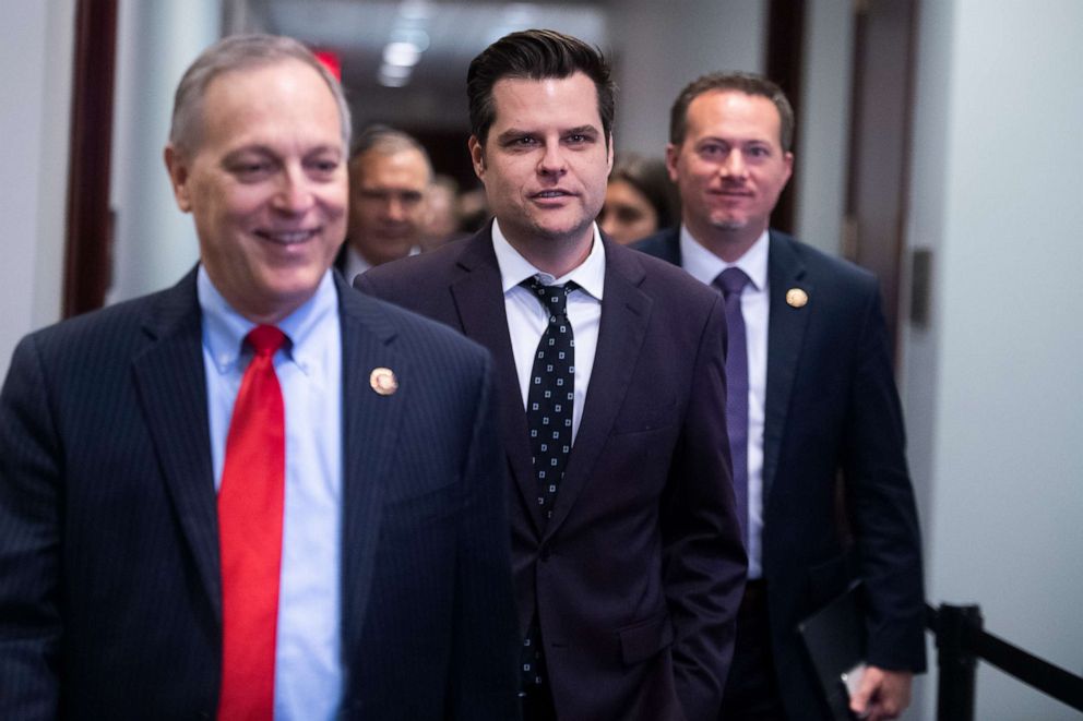 PHOTO: Reps. Matt Gaetz, center, and Andy Biggs arrive for a Congressional briefing in the Capitol Visitor Center about the coronavirus outbreak on March 4, 2020.