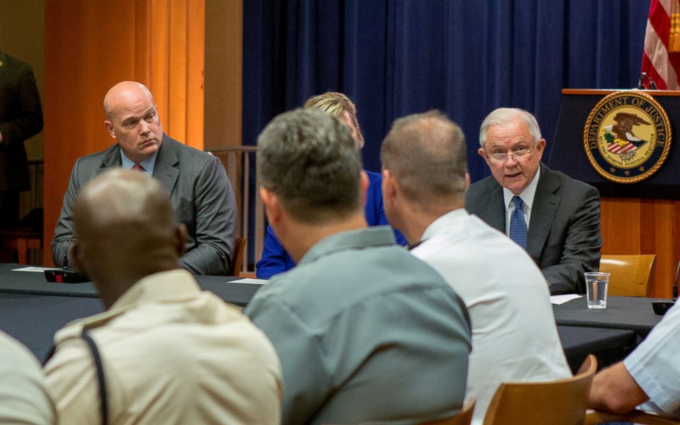 PHOTO: Matthew Whitaker looks over at Attorney General Jeff Sessions during a round table discussion with foreign liaison officers at the Justice Department in Washington, Aug. 29, 2018.