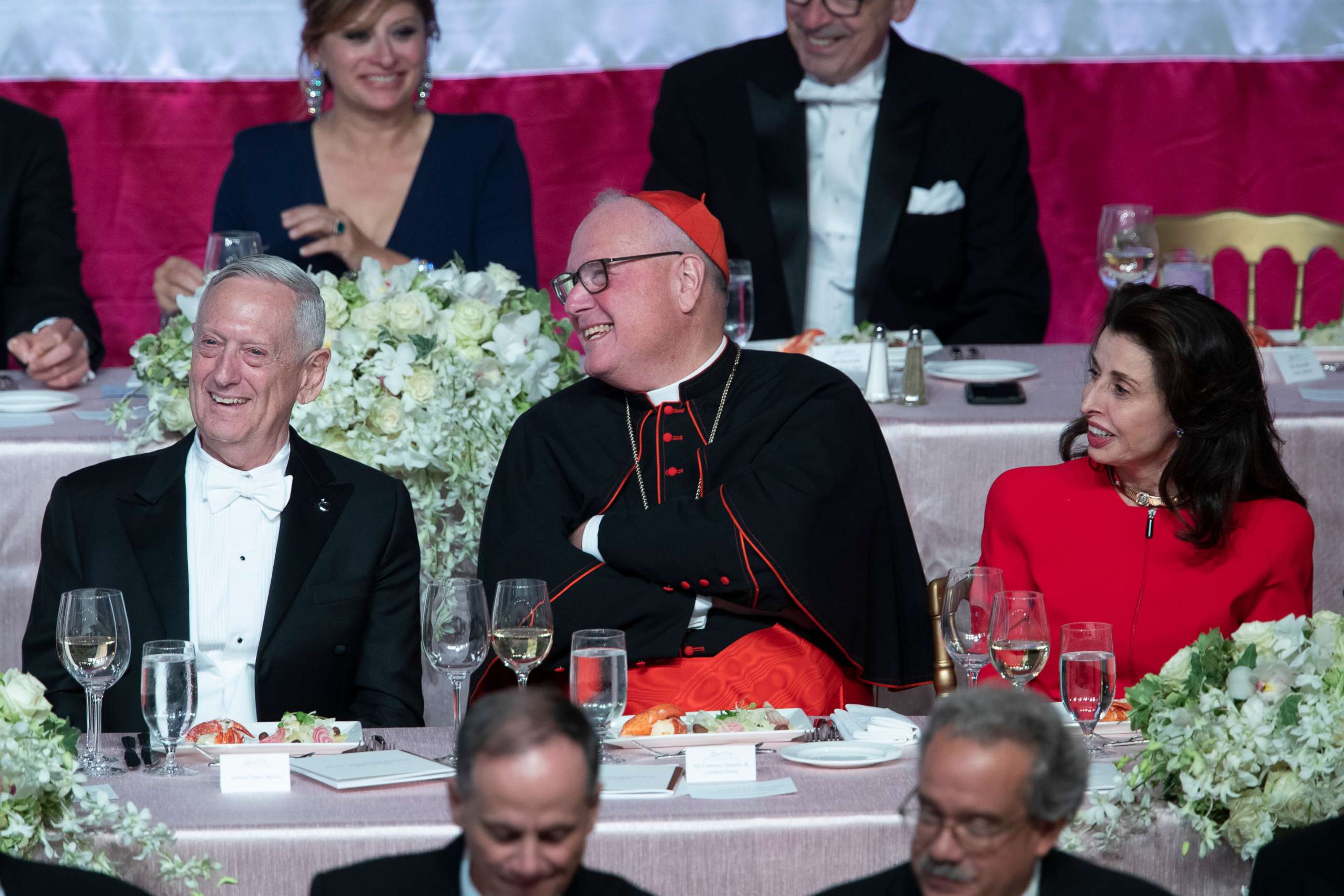 PHOTO: Former U.S. Secretary of Defense Jim Mattis, left, Cardinal Timothy Dolan, center, and Happy Warrior Award Recipient Mary Ann Tighe react to opening remarks during the 74th Annual Alfred E. Smith Dinner, Thursday, Oct. 17, 2019, in New York.
