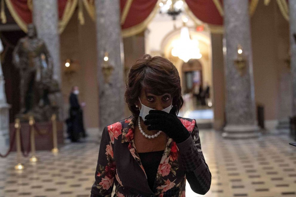 PHOTO: Maxine Waters walks out of the chamber of the House of Representatives in Washington, DC, April 23, 2020.